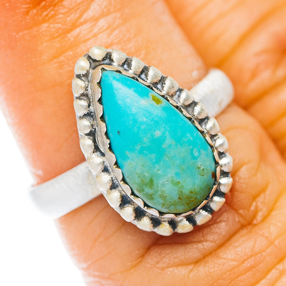 Sterling silver turquoise teardrop ring with stone bezel and rope detail