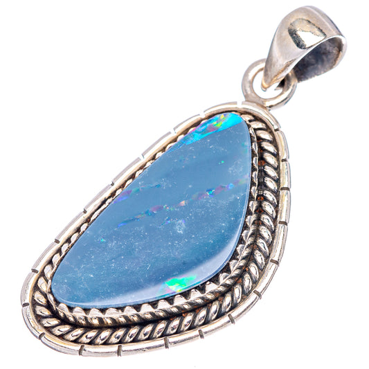 Sterling silver teardrop opal pendant with blue opal center and detailed rope frame.
