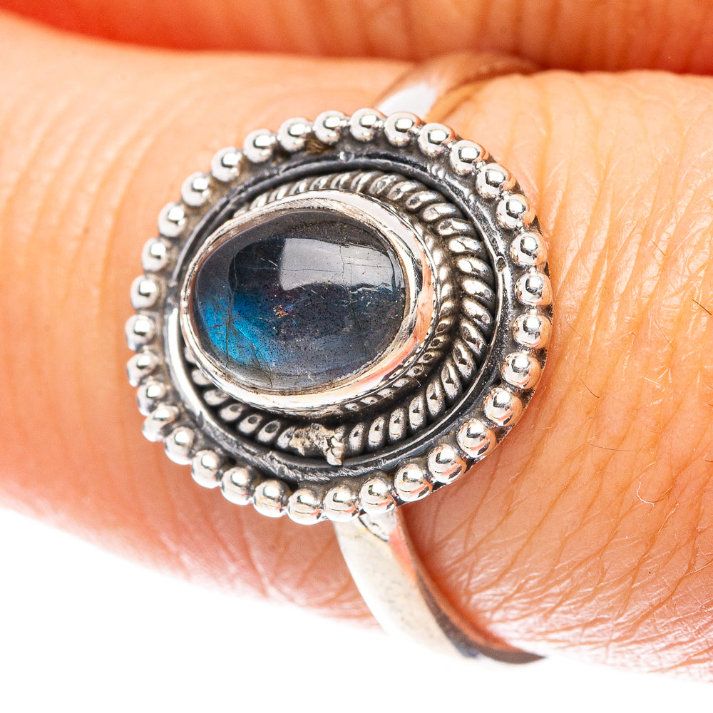 Sterling silver dainty ring with oval labradorite cabochon, dark blue flash setting