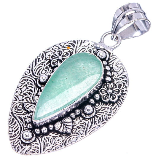 German silver teardrop pendant with green aventurine and ornate filigree bezel