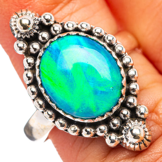 Sterling silver ring with round blue-green opal-like gemstone in ornate beaded frame