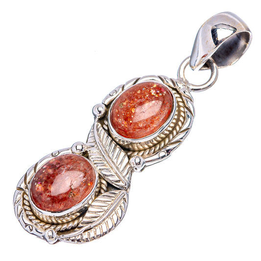 Sterling silver sunstone pendant with two oval reddish-brown cabochons and bail loop