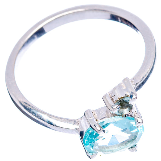 Sterling silver ring with faceted oval blue gemstone set in four prongs