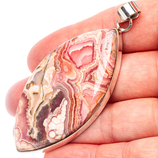 Rhodochrosite pendant with oval pink-white stone in sterling silver frame