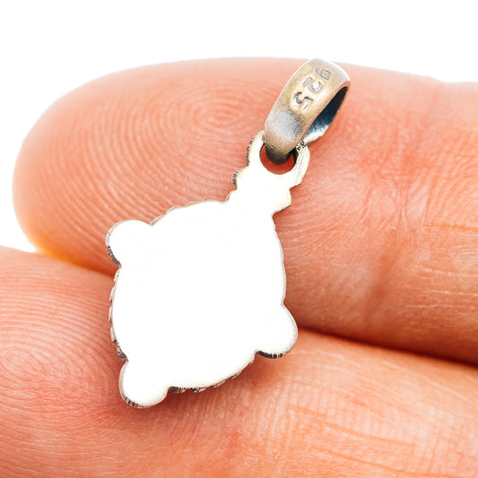 Sterling silver silhouette pendant with openwork cutout and stamped bail