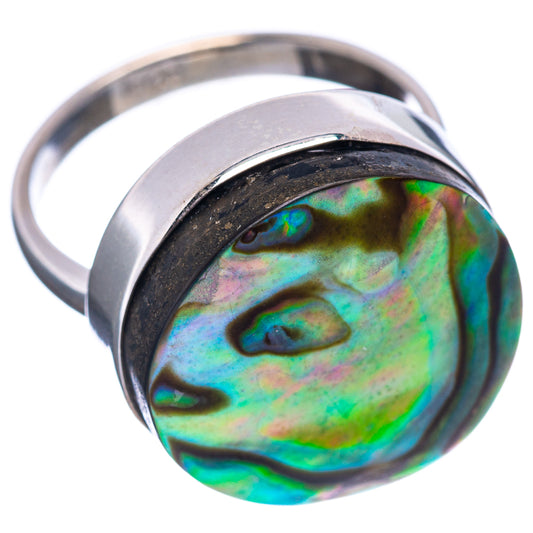 Abalone shell ring with vivid green-blue iridescent stone in polished silver band
