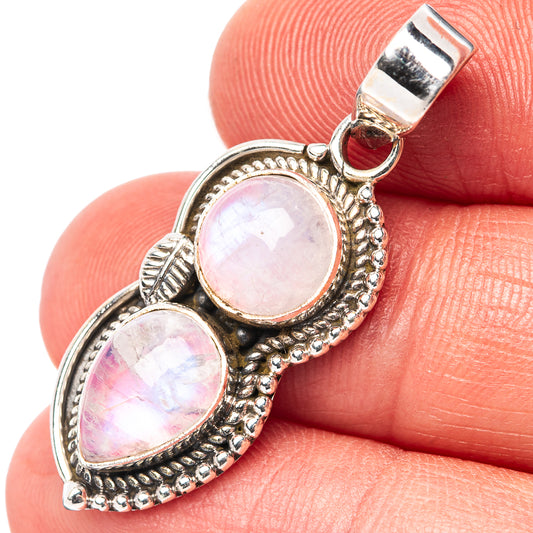 Pink moonstone pendant with two oval stones in .925 sterling silver frame and bail.