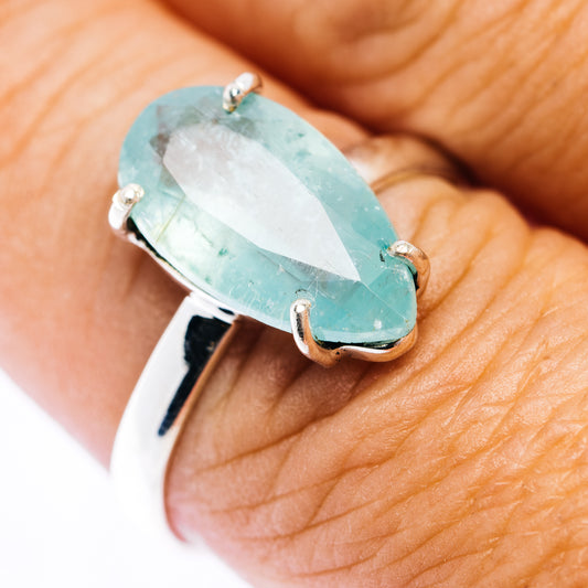 Sterling silver ring with oval faceted Paraiba kyanite gemstone, four prongs