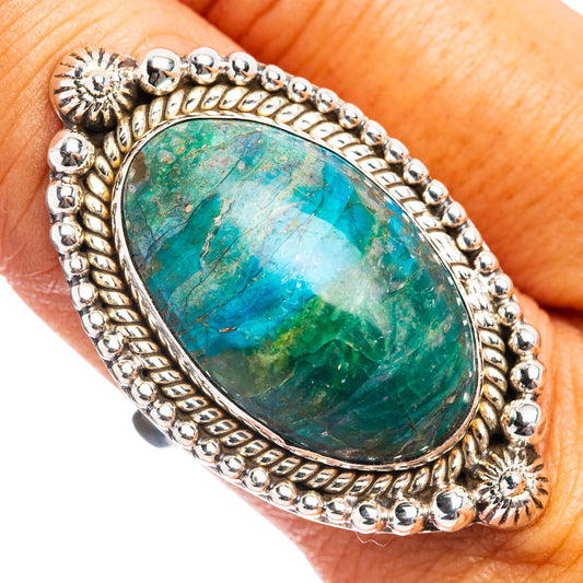 Sterling opal ring on finger, oval blue-green stone in raised border, beaded sides, size 9