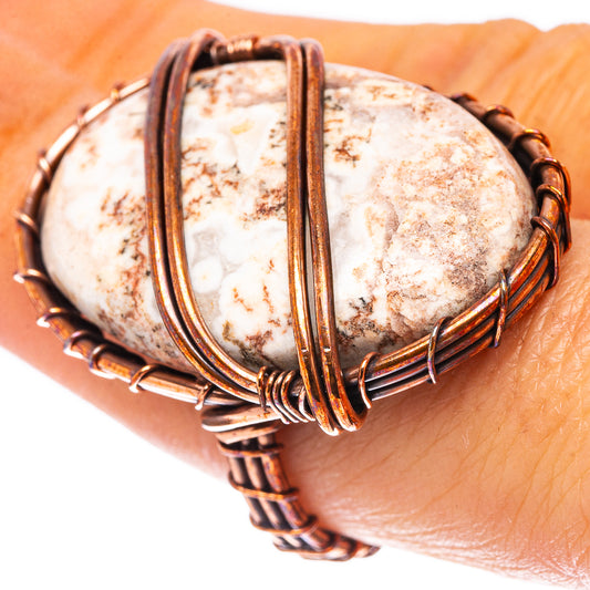 Oxidized copper wire-wrapped jasper ring with white and brown speckled oval stone