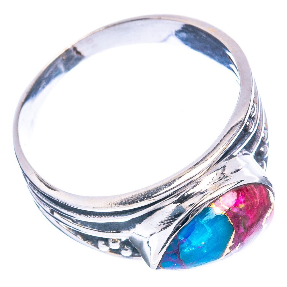 Oval pink and turquoise gemstone ring with polished silver band and carved details