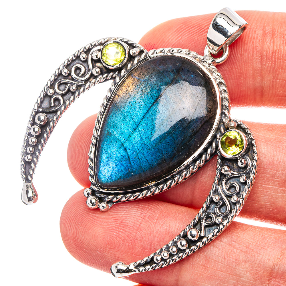 Sterling silver labradorite pendant with peridot accents and heart-shaped setting
