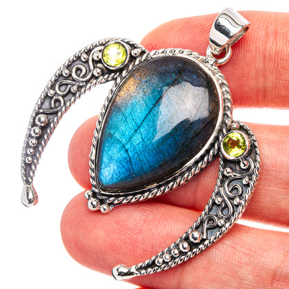 Sterling silver labradorite pendant with peridot accents and heart-shaped setting