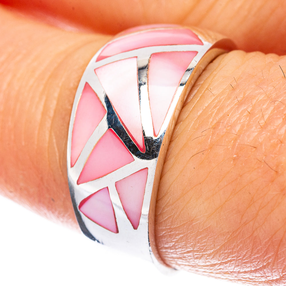 Sterling silver ring with pink geometric mother-of-pearl inlay on finger close-up