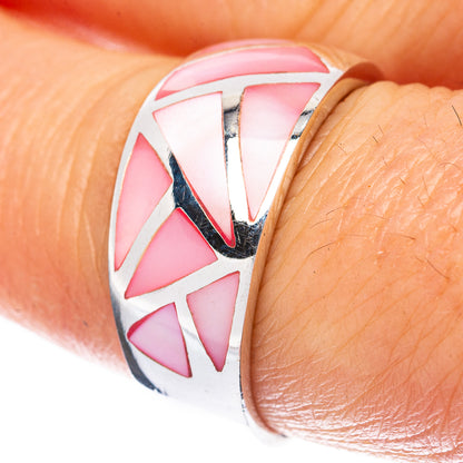 Sterling silver ring with pink geometric mother-of-pearl inlay on finger close-up