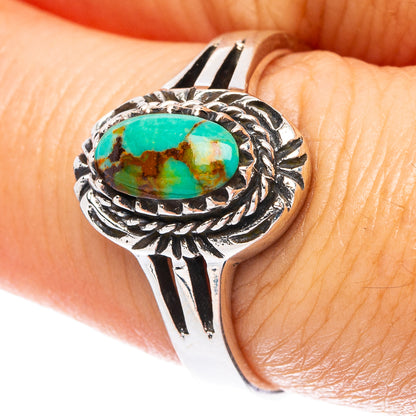 Oval turquoise cabochon sterling silver ring with ornate rope and leaf accents