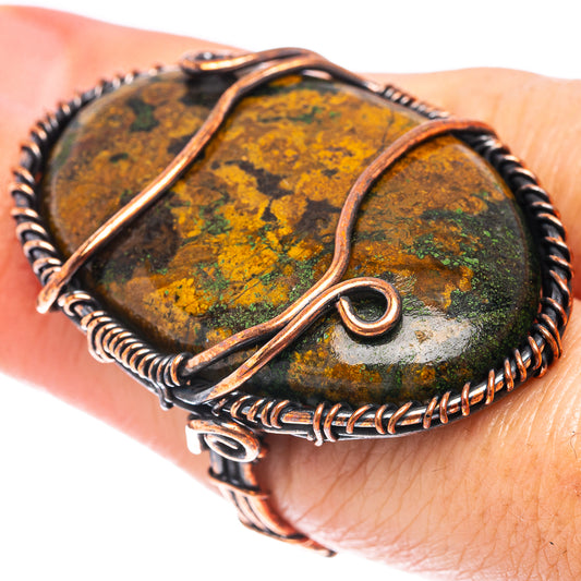 Oxidized copper wire wrap ring with green-yellow Hungarian agate stone, open loop detail