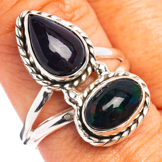 Sterling silver ring with two oval dark opal gemstones in ornate settings
