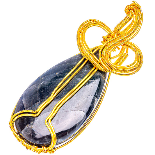 Gold-plated wire wrap pendant showing looped bail over dark larvikite oval cabochon