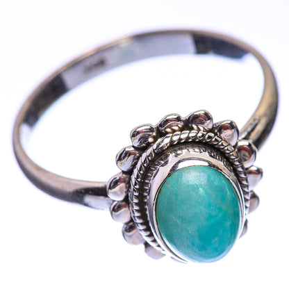 Sterling silver dainty ring with oval green cabochon, detailed beaded setting