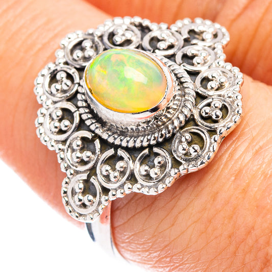 Opal ring in sterling silver with ornate filigree and oval green-yellow Ethiopian opal