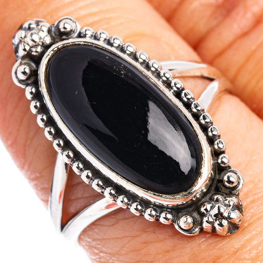 Oval black onyx set in .925 sterling silver ring with beaded edge detail
