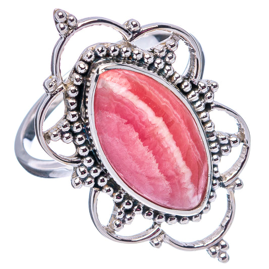 Pink oval rhodochrosite ring in .925 sterling silver with openwork circular prongs