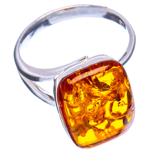 Polished sterling silver ring with teardrop amber cabochon