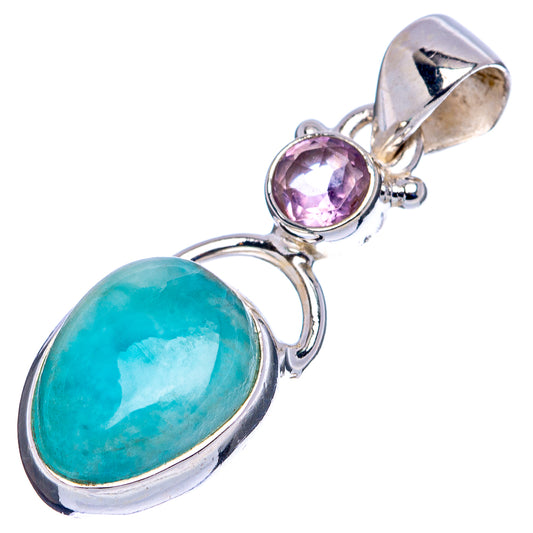 Sterling silver pendant featuring oval Larimar stone and round pink gemstone in halo