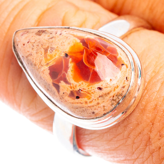 Oval fire opal cabochon ring in .925 sterling silver bezel setting