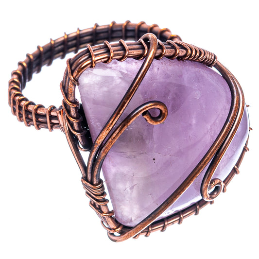 Oxidized copper wire wrap ring with purple teardrop stone, side angle close-up