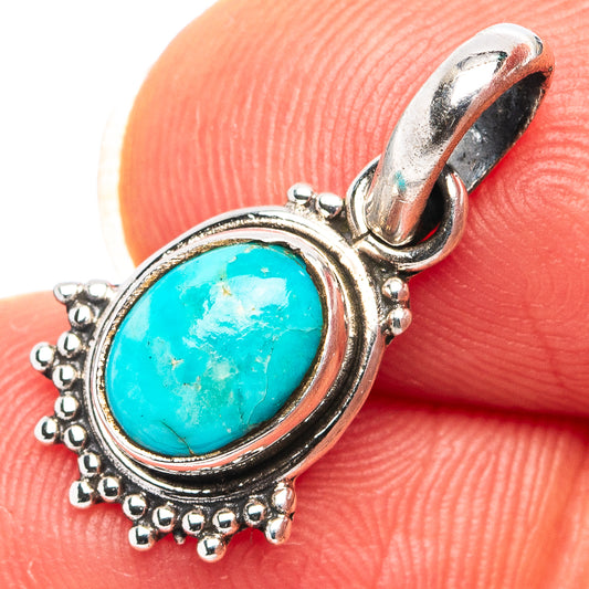 Turquoise oval pendant with .925 sterling silver bezel and beaded halo, hinged bail loop