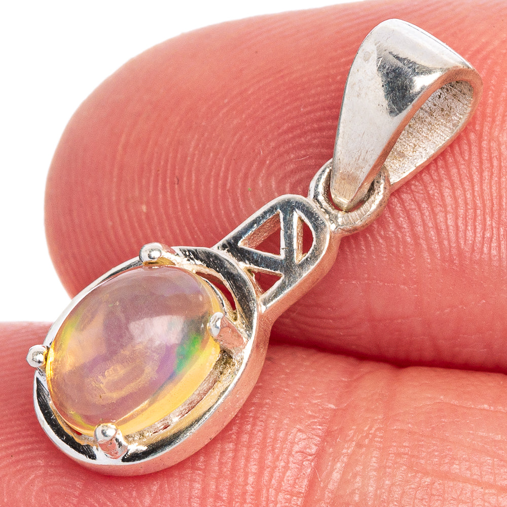 Round opal pendant in sterling silver with prong-set cabochon and shield-link bail
