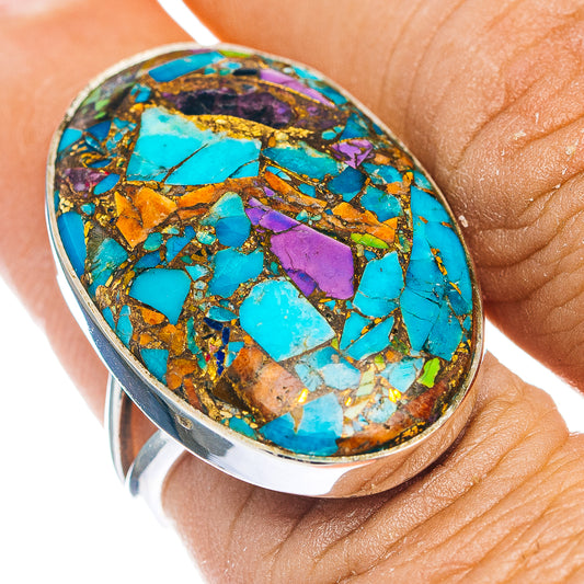 Oval turquoise mosaic ring in .925 sterling silver with purple and gold accents, on finger
