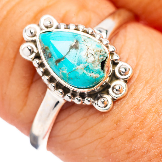 Sterling silver turquoise teardrop ring with beaded halo and ornate crown setting