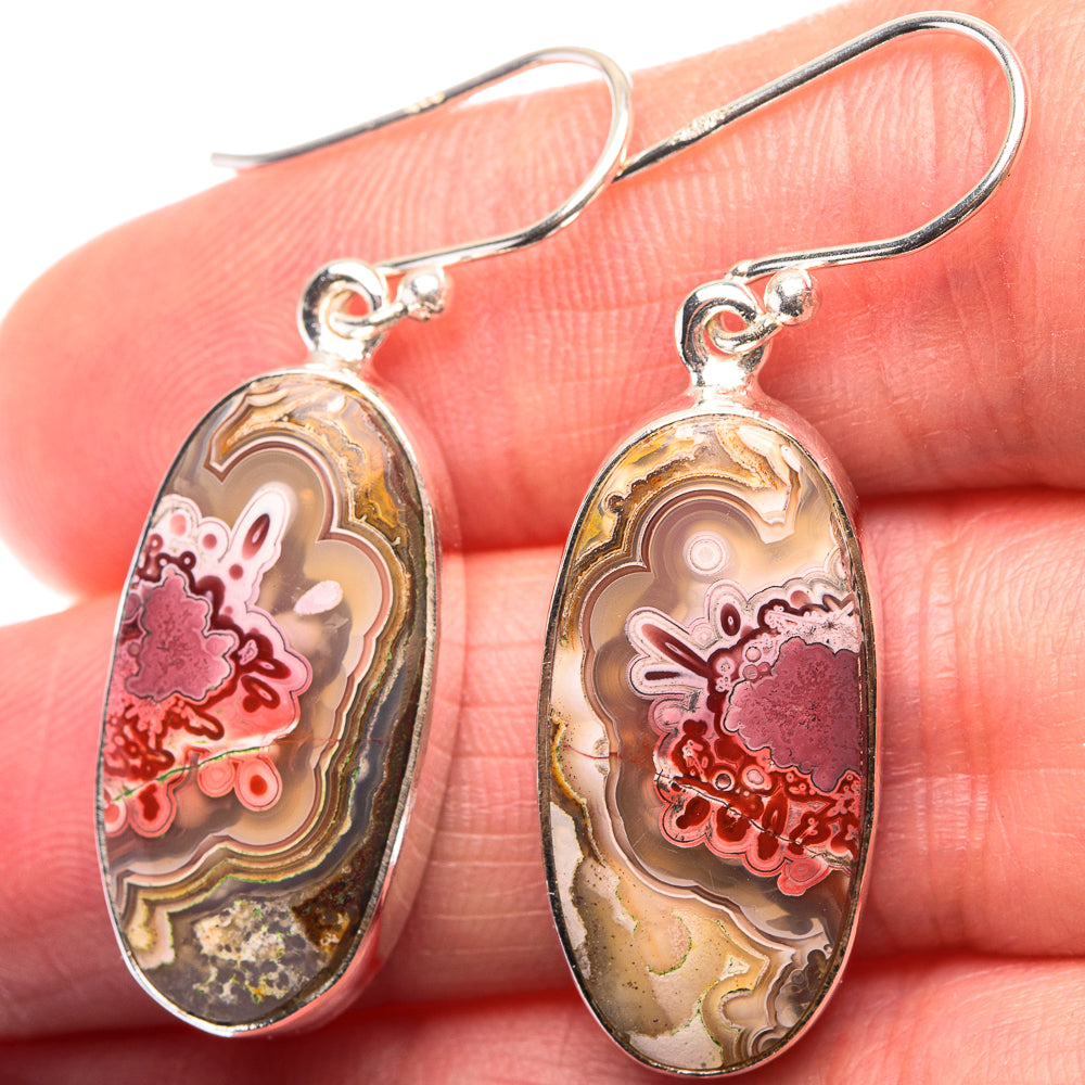 Oval crazy lace agate earrings with pink, cream, and gold bands; sterling silver hooks