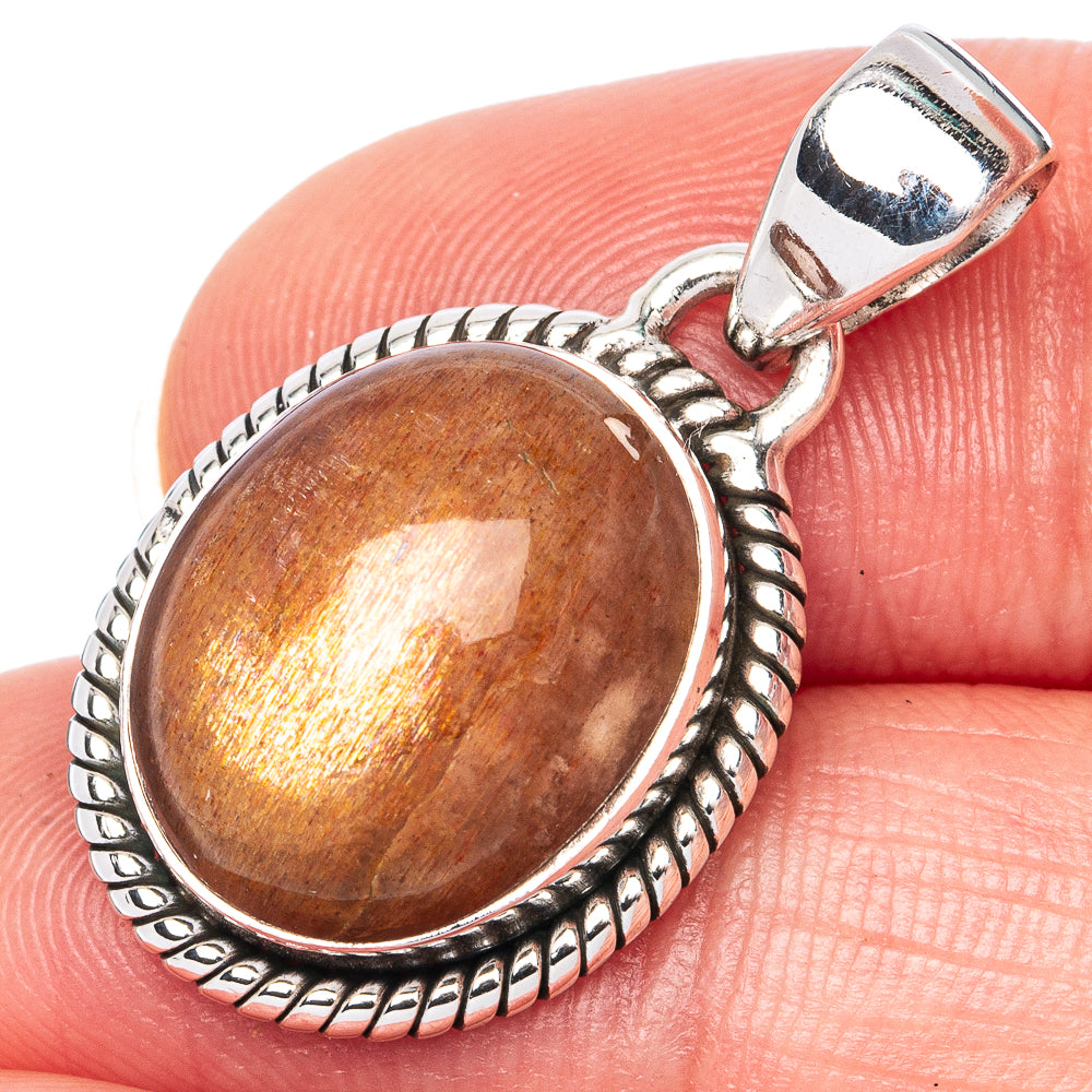 925 sterling silver oval sunstone pendant with textured bezel and bail