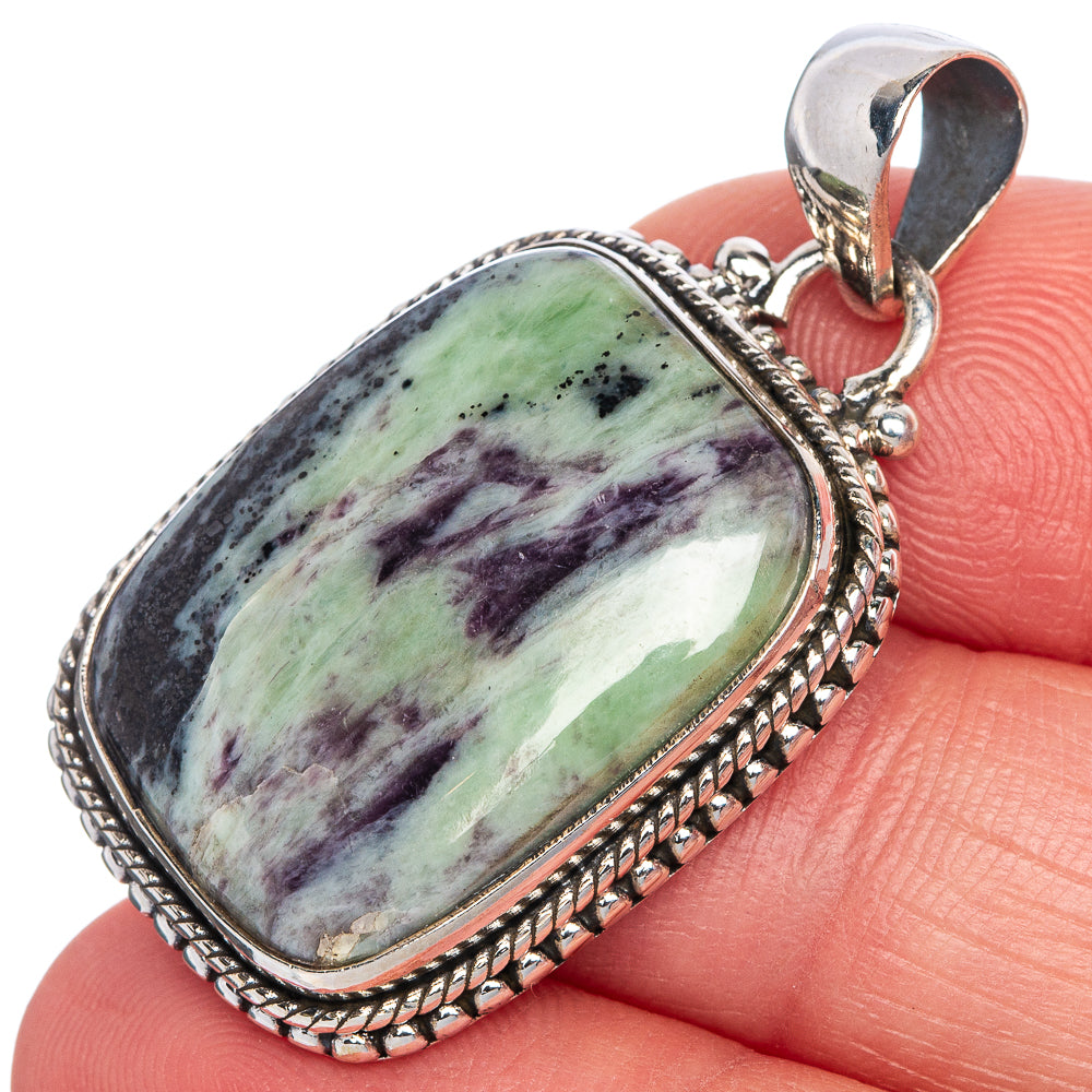 Oval kammererite gemstone pendant with rope-edge frame, sterling silver bail