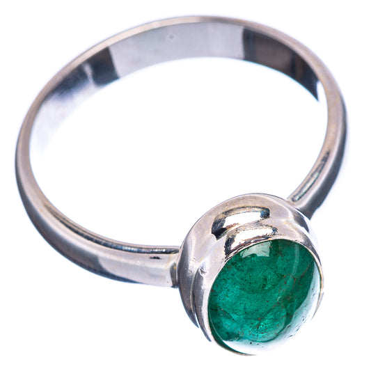 Sterling silver ring featuring an oval green emerald in round bezel