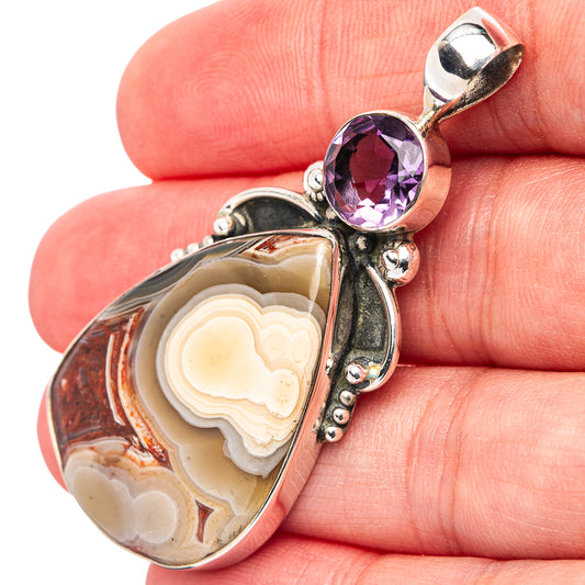Sterling silver pendant with oval amethyst and Crazy Lace Agate cabochon