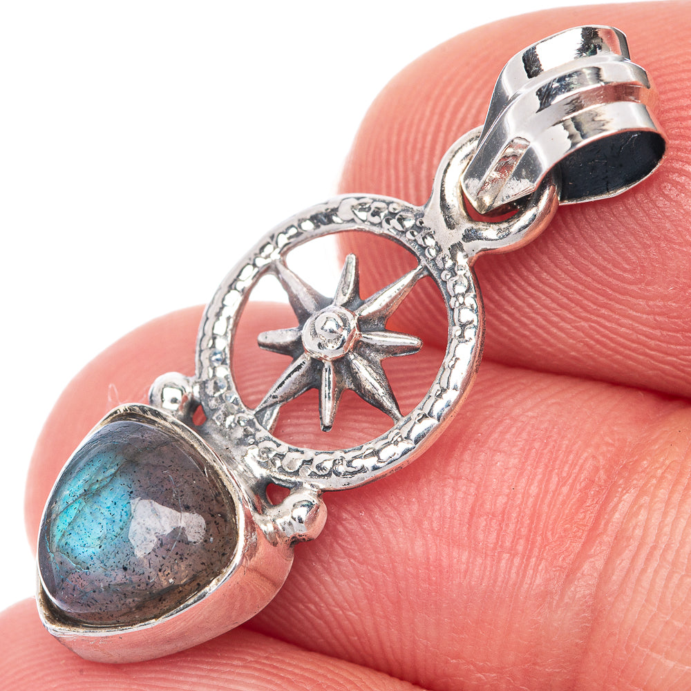 Sterling silver labradorite pendant close-up with oval cabochon and star medallion circle