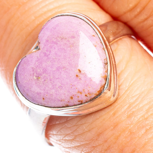 Sterling silver heart ring with pink-purple cabochon stone on finger, size 9