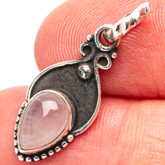 Rose quartz pendant in .925 sterling silver with ornate dark setting and teardrop bail