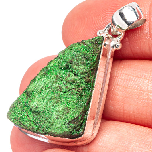 Sterling silver uvarovite pendant with green rough stone, side view of bail and accent