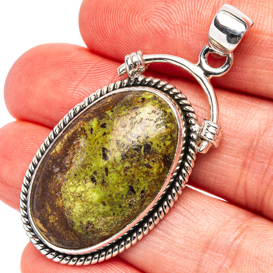 Sterling silver oval gaspeite pendant with green and brown mottled stone bezel