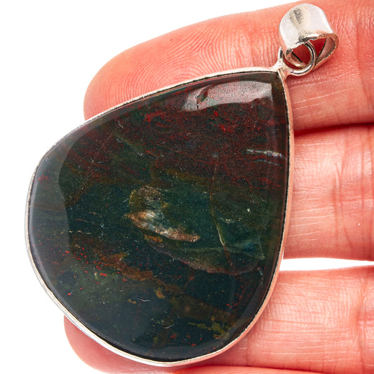 Silver-plated teardrop pendant with dark green bloodstone speckled in red