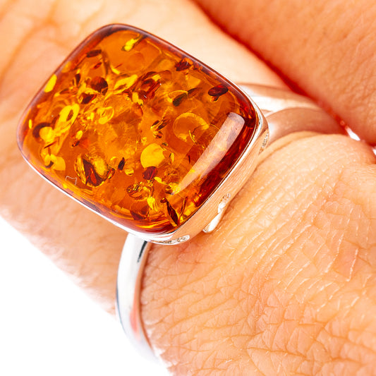 Sterling silver ring with oval honey Baltic amber cabochon.