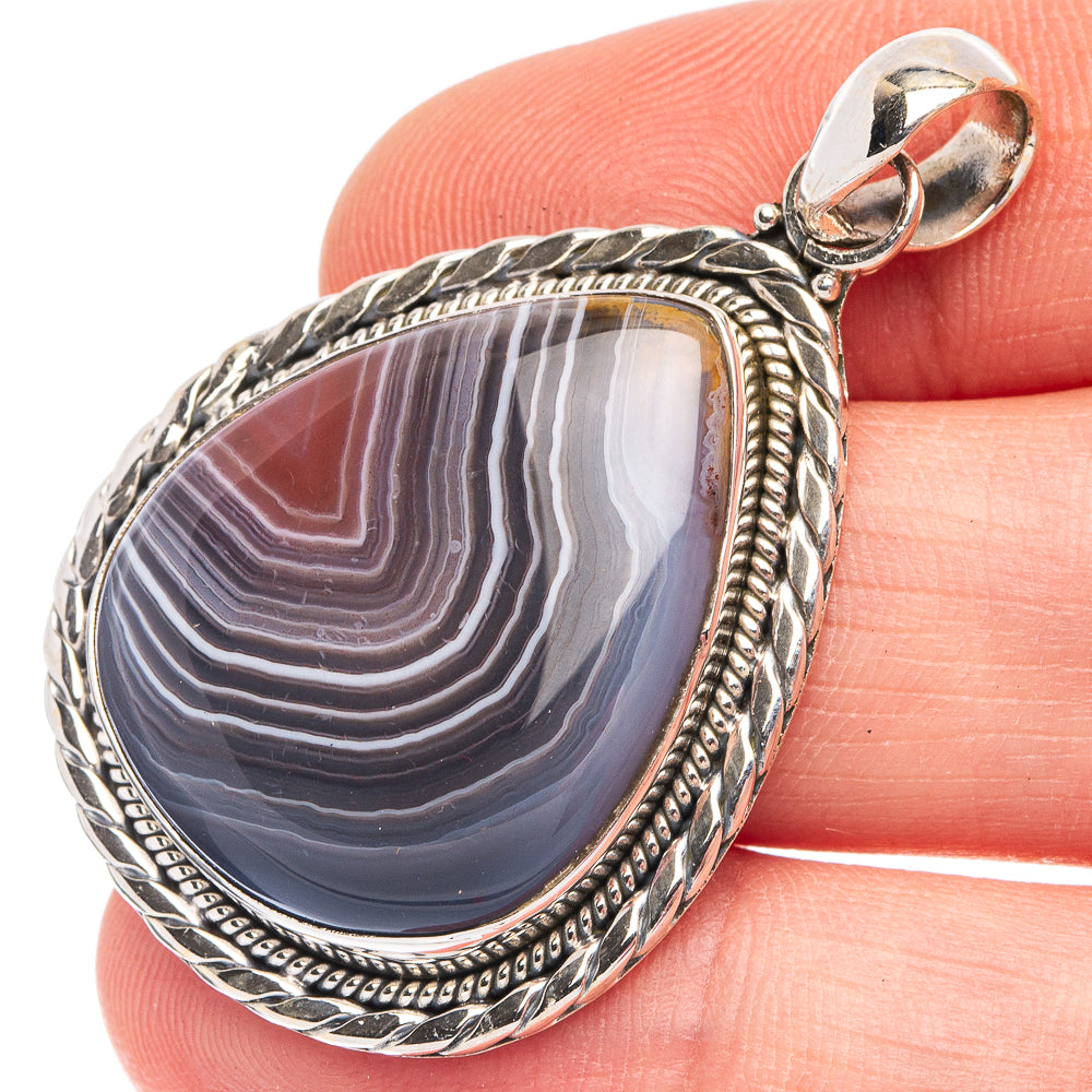 Oval Botswana agate pendant in 925 sterling silver with ornate bezel and bail