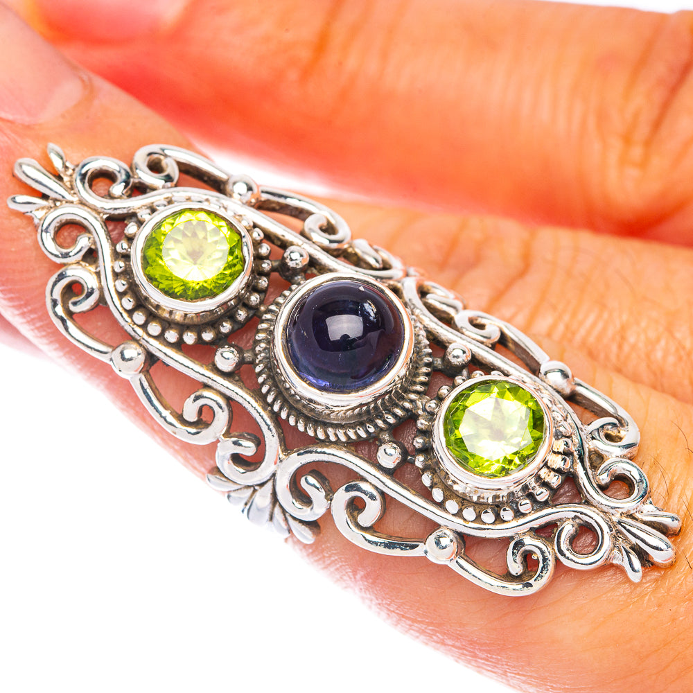 Sterling silver peridot and kyanite cabochon ring, ornate filigree border