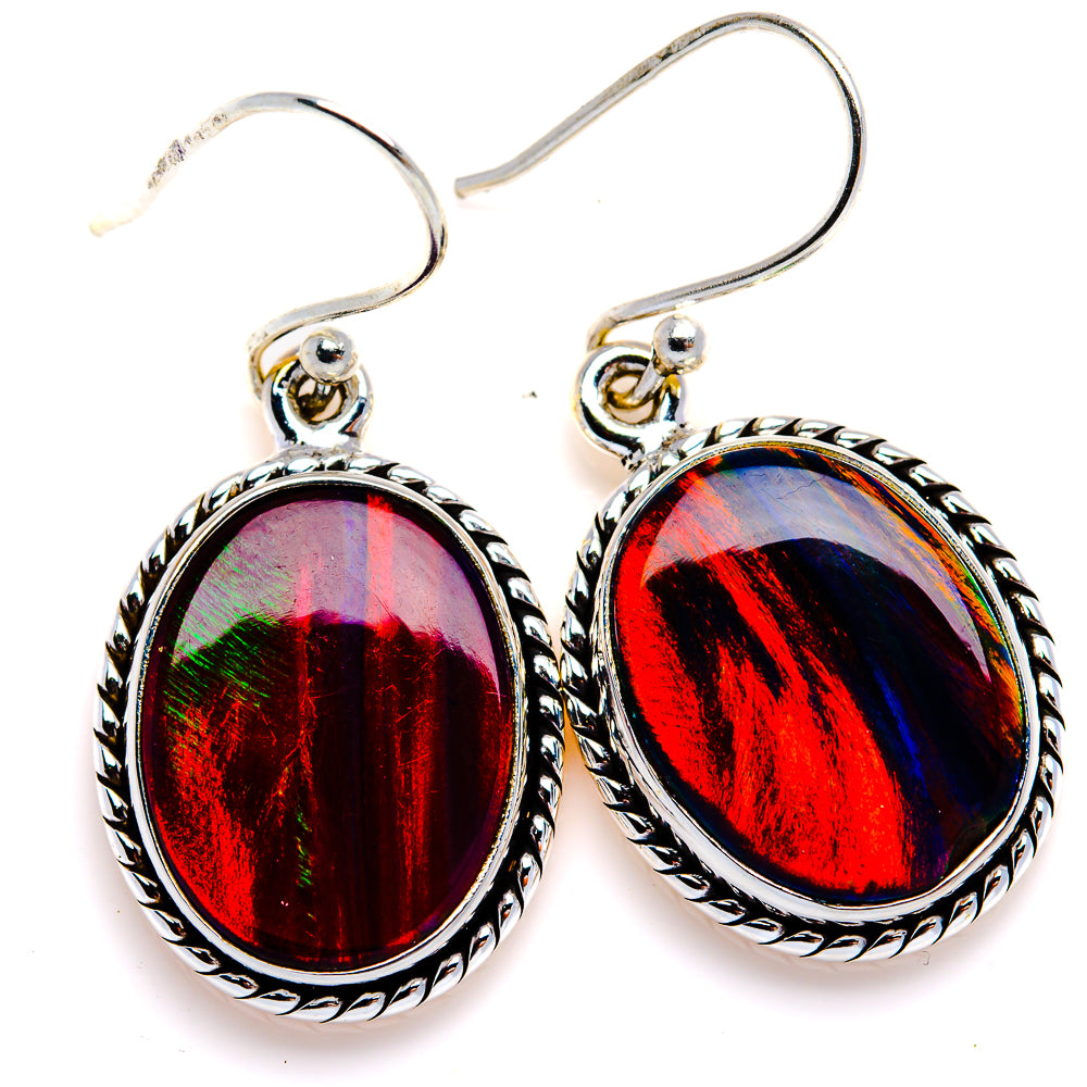 Sterling silver oval opal drop earrings with ornate bezel and red-blue swirled stones